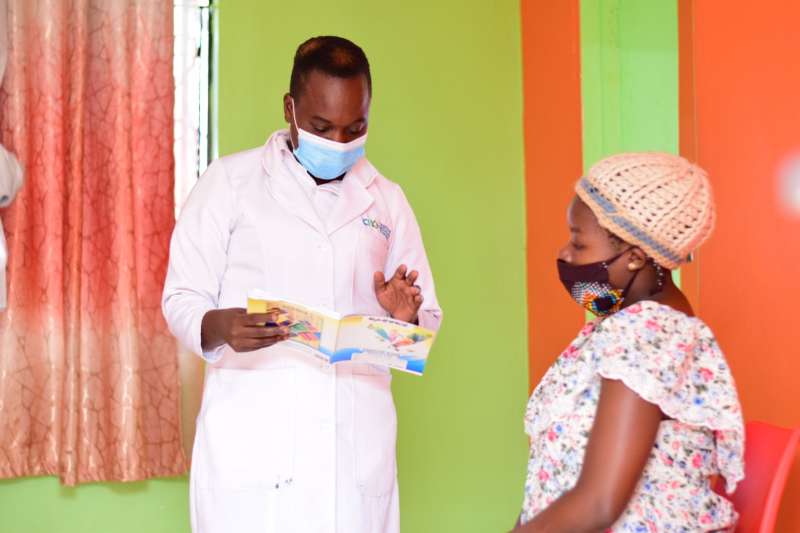 Nurse at a Nairobi private clinic attending to a mother