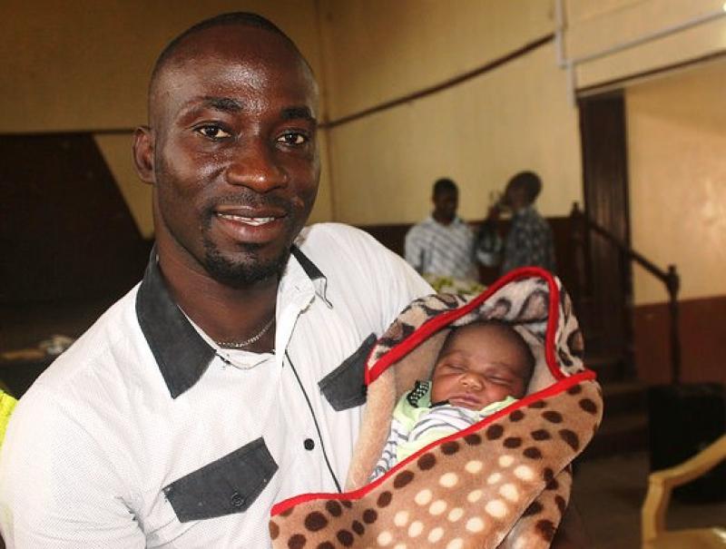 Man and newborn in Sierra Leone